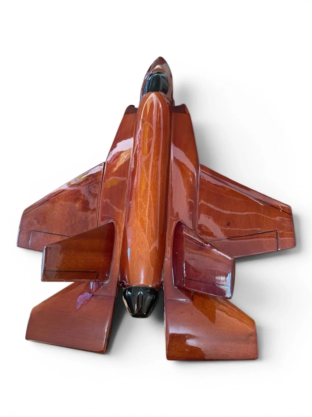 Mahogany wood model of a stealth fighter jet, handcrafted